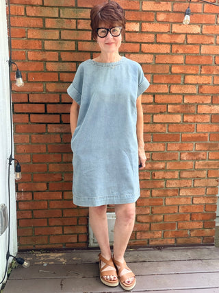 Paola Denim Back Button Dress - Denim Blue-Dresses & RompersSHE + SKY Paola Denim Back Button Mini Dress - Denim Blue | VerClare Boutique-Shop the SHE + SKY Paola Denim Back Button Dress in Denim Blue. Washed denim, drop sleeves, back button detail, pockets, mini length. Sizes S–L.-VerClare Boutique