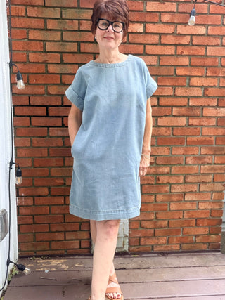 Paola Denim Back Button Dress - Denim Blue-Dresses & RompersSHE + SKY Paola Denim Back Button Mini Dress - Denim Blue | VerClare Boutique-Shop the SHE + SKY Paola Denim Back Button Dress in Denim Blue. Washed denim, drop sleeves, back button detail, pockets, mini length. Sizes S–L.-VerClare Boutique