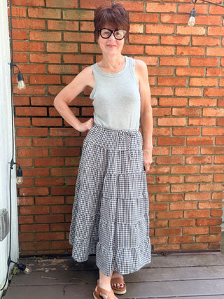 Zaria Gingham Tiered Maxi Skirt-BottomsRaisonnel Zaria Gingham Tiered Maxi Skirt | VerClare Boutique-Shop the Raisonnel Zaria Gingham Tiered Maxi Skirt. Lightweight woven, gingham check, multi-tiered puff design, elastic waist, fully lined. Sizes S–L.-VerClare Boutique