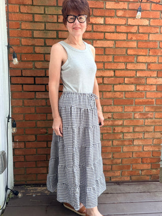 Zaria Gingham Tiered Maxi Skirt-BottomsRaisonnel Zaria Gingham Tiered Maxi Skirt | VerClare Boutique-Shop the Raisonnel Zaria Gingham Tiered Maxi Skirt. Lightweight woven, gingham check, multi-tiered puff design, elastic waist, fully lined. Sizes S–L.-VerClare Boutique