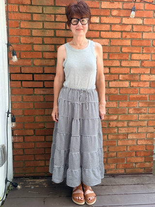Zaria Gingham Tiered Maxi Skirt-BottomsRaisonnel Zaria Gingham Tiered Maxi Skirt | VerClare Boutique-Shop the Raisonnel Zaria Gingham Tiered Maxi Skirt. Lightweight woven, gingham check, multi-tiered puff design, elastic waist, fully lined. Sizes S–L.-VerClare Boutique