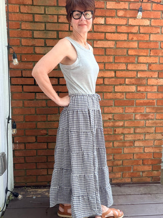 Zaria Gingham Tiered Maxi Skirt-BottomsRaisonnel Zaria Gingham Tiered Maxi Skirt | VerClare Boutique-Shop the Raisonnel Zaria Gingham Tiered Maxi Skirt. Lightweight woven, gingham check, multi-tiered puff design, elastic waist, fully lined. Sizes S–L.-VerClare Boutique