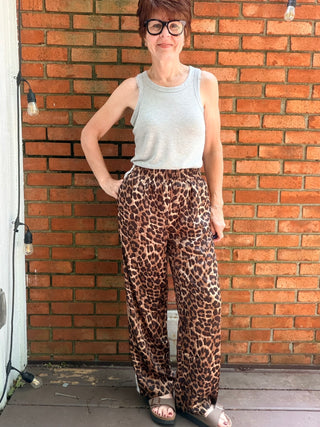 Zivah Leopard Pants-ALL SALES FINAL-BottomsZivah Leopard Print Pants | Wishlist – VerClare Boutique-Shop the Wishlist Zivah Leopard Pants. Polyester-spandex, elastic waist, side pockets, side trim detail, relaxed full-length fit. Sizes S–L at VerClare Boutique.-VerClare Boutique