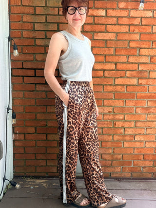 Zivah Leopard Pants-ALL SALES FINAL-BottomsZivah Leopard Print Pants | Wishlist – VerClare Boutique-Shop the Wishlist Zivah Leopard Pants. Polyester-spandex, elastic waist, side pockets, side trim detail, relaxed full-length fit. Sizes S–L at VerClare Boutique.-VerClare Boutique
