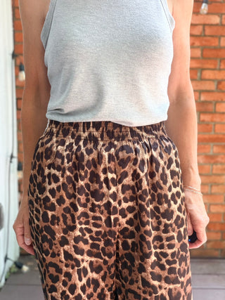 Zivah Leopard Pants-ALL SALES FINAL-BottomsZivah Leopard Print Pants | Wishlist – VerClare Boutique-Shop the Wishlist Zivah Leopard Pants. Polyester-spandex, elastic waist, side pockets, side trim detail, relaxed full-length fit. Sizes S–L at VerClare Boutique.-VerClare Boutique