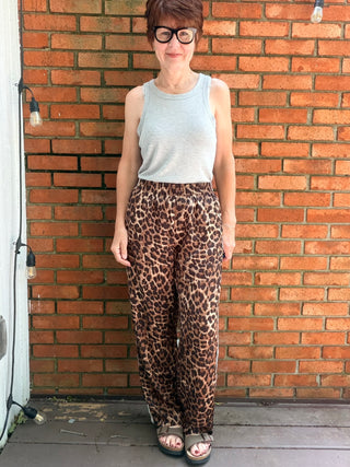 Zivah Leopard Pants-ALL SALES FINAL-BottomsZivah Leopard Print Pants | Wishlist – VerClare Boutique-Shop the Wishlist Zivah Leopard Pants. Polyester-spandex, elastic waist, side pockets, side trim detail, relaxed full-length fit. Sizes S–L at VerClare Boutique.-VerClare Boutique