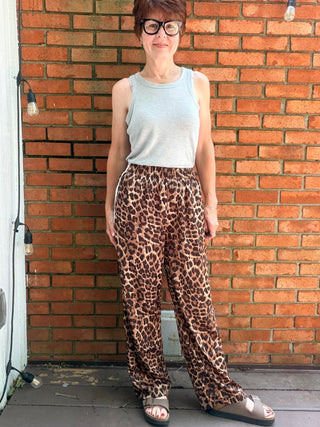 Zivah Leopard Pants-ALL SALES FINAL-BottomsZivah Leopard Print Pants | Wishlist – VerClare Boutique-Shop the Wishlist Zivah Leopard Pants. Polyester-spandex, elastic waist, side pockets, side trim detail, relaxed full-length fit. Sizes S–L at VerClare Boutique.-VerClare Boutique