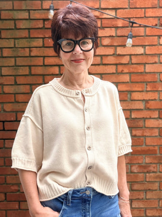 Natalie Sweater - Natural-The Workshop Natalie Sweater - Natural | VerClare Boutique-Shop the Natalie Sweater in Natural. Lightweight cotton/acrylic blend, wood buttons, ribbed cuffs and waist, short sleeve, oversized fit. Sizes S–L.-VerClare Boutique