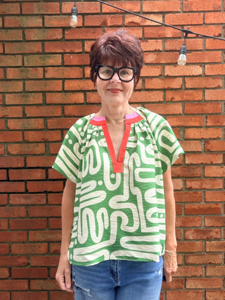 Tiana Pattern V-Neck Top - Green-Tops CasualTiana Pattern V-Neck Top – Green | THML – VerClare Boutique-Shop the THML Tiana Pattern V-Neck Top in Green. Rayon-nylon woven, V-neck, short sleeves, flowy patterned silhouette, true-to-size fit. Sizes XS–L.-VerClare Boutique