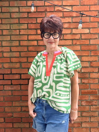 Tiana Pattern V-Neck Top - Green-Tops CasualTiana Pattern V-Neck Top – Green | THML – VerClare Boutique-Shop the THML Tiana Pattern V-Neck Top in Green. Rayon-nylon woven, V-neck, short sleeves, flowy patterned silhouette, true-to-size fit. Sizes XS–L.-VerClare Boutique