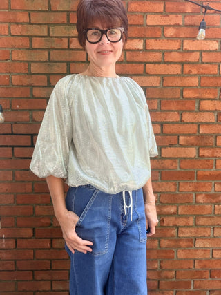 THML-Elyra Sparkle Flowy Top-Tops CasualElyra Sparkle Flowy Top | Silver Shimmer Bubble Top – THML | VerClare Boutique-Shop the THML Elyra Sparkle Flowy Top in Silver — shimmering 100% polyester, bubble flowy silhouette, perfect for holiday & nights out. Sizes XS–XL.-VerClare Boutique