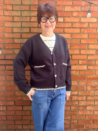 Skylar Cardigan-SweatersSkylar Cardigan | Black Whipstitch Button-Front Knit – EE:Some | VerClare Boutique-Shop the EE:Some Skylar Cardigan in black — ivory whipstitch trim, button-front, front pockets, relaxed fit. Sizes S–L. Ships fast from VerClare Boutique.-VerClare Boutique