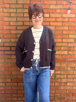 Skylar Cardigan-SweatersSkylar Cardigan | Black Whipstitch Button-Front Knit – EE:Some | VerClare Boutique-Shop the EE:Some Skylar Cardigan in black — ivory whipstitch trim, button-front, front pockets, relaxed fit. Sizes S–L. Ships fast from VerClare Boutique.-VerClare Boutique