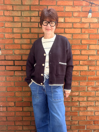 Skylar Cardigan-SweatersSkylar Cardigan | Black Whipstitch Button-Front Knit – EE:Some | VerClare Boutique-Shop the EE:Some Skylar Cardigan in black — ivory whipstitch trim, button-front, front pockets, relaxed fit. Sizes S–L. Ships fast from VerClare Boutique.-VerClare Boutique