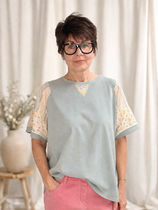 Daria French Terry Top - Lt. Blue-Tops CasualDaria French Terri Top - Lt. Blue | VerClare Boutique | Jenison MI -This French Terry Top is a beautiful soft mineral-washed French terry short-sleeve top featuring mixed print panel detailing, a classic round neckline, and an easy everyday silhouette. Free US shipping from VerClare Boutique.-VerClare Boutique